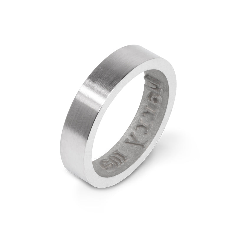 Close-up image of a unique designer Inner Message ring with 'Marry me' embossed on the inside, creating a distinct 'Marry me' impression when worn